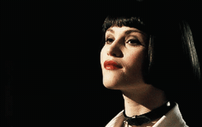 A Close Up Of A Woman 'S Face With Red Lips GIF