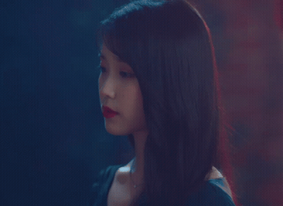 A Close Up Of A Woman 'S Face With Red Lips GIF
