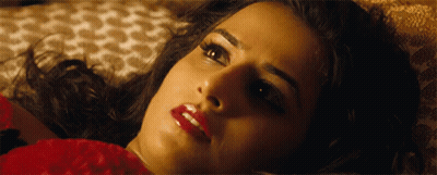 A Close Up Of A Woman 'S Face With Red Lips GIF