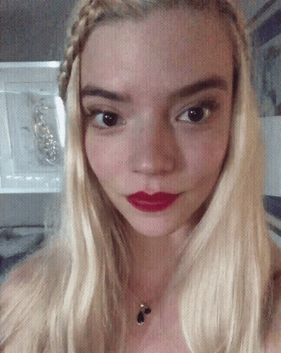 A Close Up Of A Woman 'S Face With Red Lipstick GIF