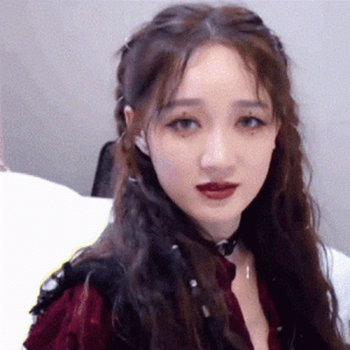 A Close Up Of A Woman 'S Face With Red Lipstick GIF