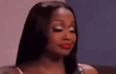 A Close Up Of A Woman 'S Face With Red Lipstick . GIF