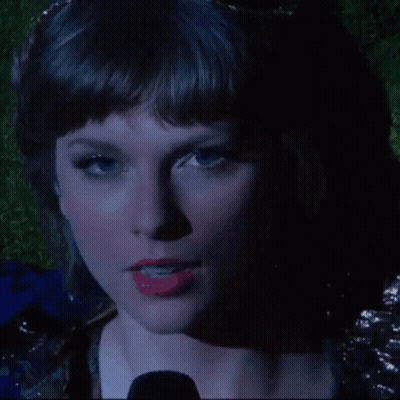A Close Up Of A Woman 'S Face With Red Lipstick GIF