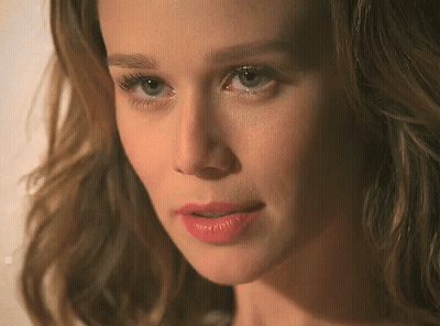 A Close Up Of A Woman 'S Face With Red Lipstick On Her Lips GIF