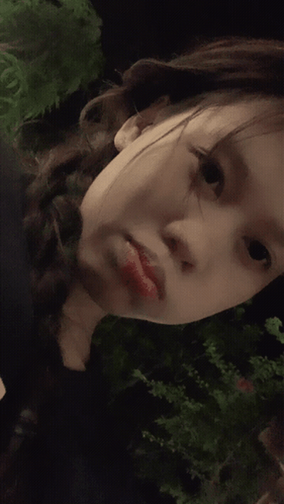 A Close Up Of A Woman 'S Face With Red Lipstick On GIF