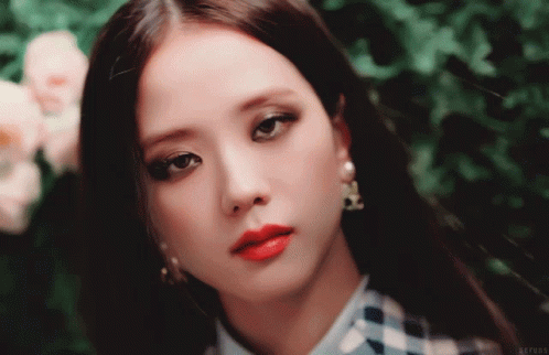 A Close Up Of A Woman 'S Face With Red Lipstick GIF