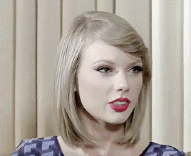 A Close Up Of A Woman 'S Face With Red Lipstick . GIF