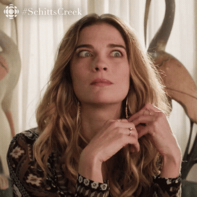 A Close Up Of A Woman 'S Face With #Schitts Creek Written In The Corner GIF