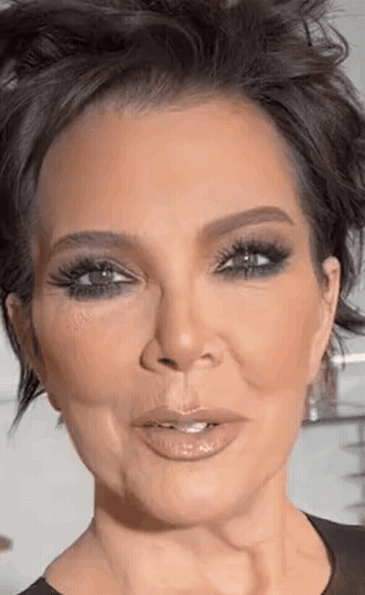 A Close Up Of A Woman 'S Face With Short Hair And A Very Serious Look On Her Face . GIF