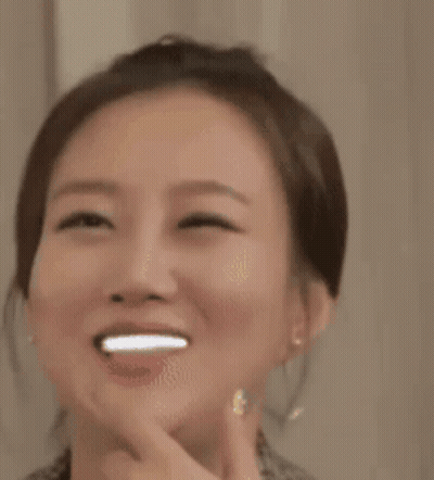 A Close Up Of A Woman 'S Face With Stars On Her Face GIF