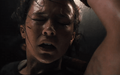 A Close Up Of A Woman 'S Face With Sweat On Her Forehead GIF