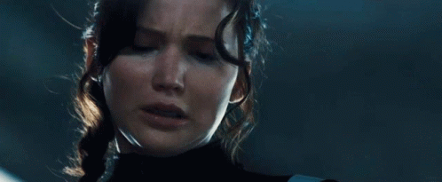 A Close Up Of A Woman 'S Face With Tears Coming Out Of Her Eyes GIF