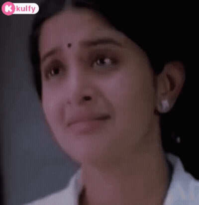 A Close Up Of A Woman 'S Face With Tears Coming Out Of Her Eyes . GIF