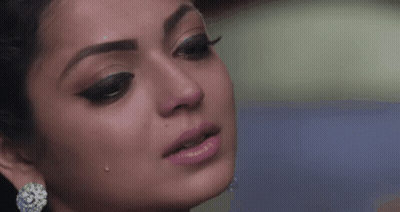 A Close Up Of A Woman 'S Face With Tears Coming Out Of Her Eyes . GIF
