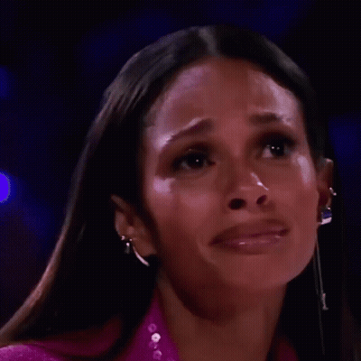 A Close Up Of A Woman 'S Face With Tears Running Down Her Cheeks . GIF