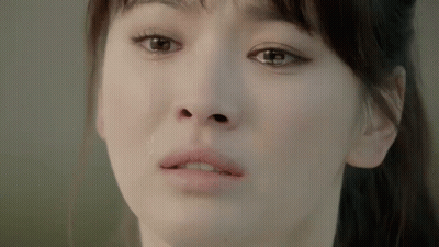 A Close Up Of A Woman 'S Face With Tears Running Down Her Face . GIF