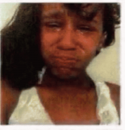 A Close Up Of A Woman 'S Face With Tears Running Down Her Face GIF
