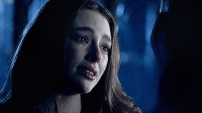 A Close Up Of A Woman 'S Face With Tears Running Down Her Face . GIF