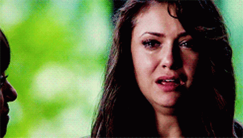 A Close Up Of A Woman 'S Face With Tears Running Down Her Face . GIF