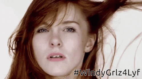 A Close Up Of A Woman 'S Face With The Hashtag # Windygirlz4lyf GIF