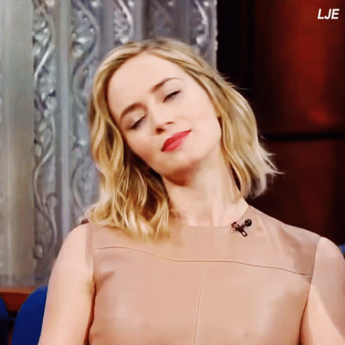 A Close Up Of A Woman 'S Face With The Letters Lje On The Bottom Right GIF