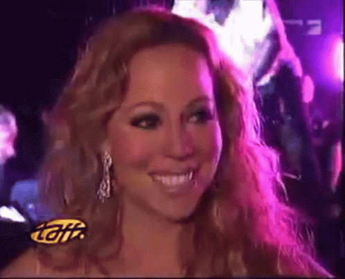 A Close Up Of A Woman 'S Face With The Letters Tgii On The Bottom Right GIF