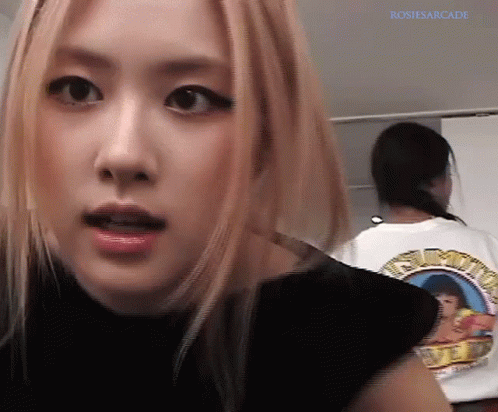 A Close Up Of A Woman 'S Face With The Name Rosiesarcade Written On The Bottom GIF