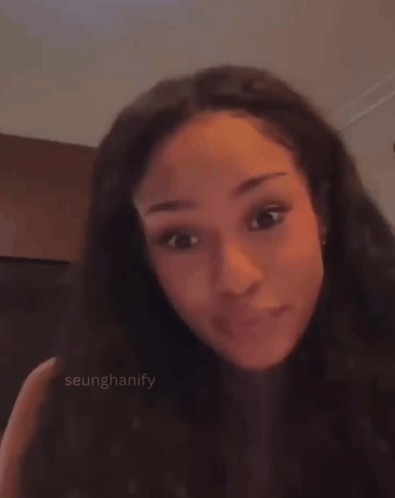 A Close Up Of A Woman 'S Face With The Name Seunghanify Visible GIF