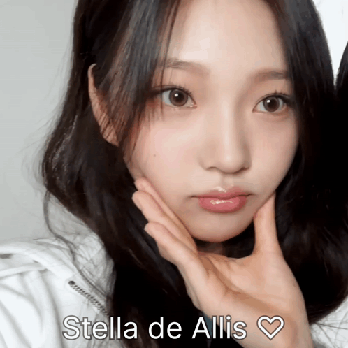 A Close Up Of A Woman 'S Face With The Name Stella De Allis Written Above Her GIF