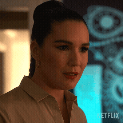 A Close Up Of A Woman 'S Face With The Netflix Logo In The Corner GIF