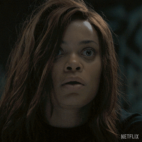 A Close Up Of A Woman 'S Face With The Netflix Logo Visible GIF