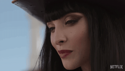 A Close Up Of A Woman 'S Face With The Netflix Logo Visible GIF
