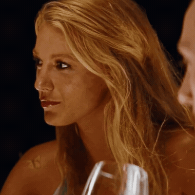 A Close Up Of A Woman 'S Face With The Number 18 In The Corner GIF