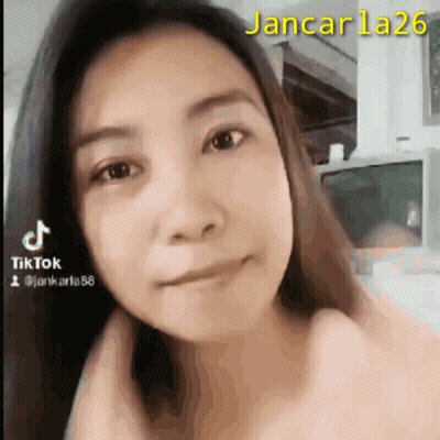 A Close Up Of A Woman 'S Face With The Number 26 In Yellow GIF