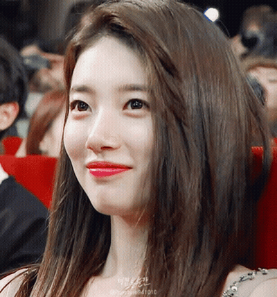 A Close Up Of A Woman 'S Face With The Number 41010 On The Bottom GIF