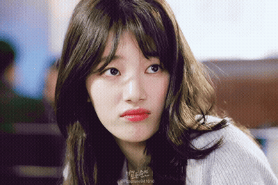 A Close Up Of A Woman 'S Face With The Number 94 1010 On The Bottom GIF