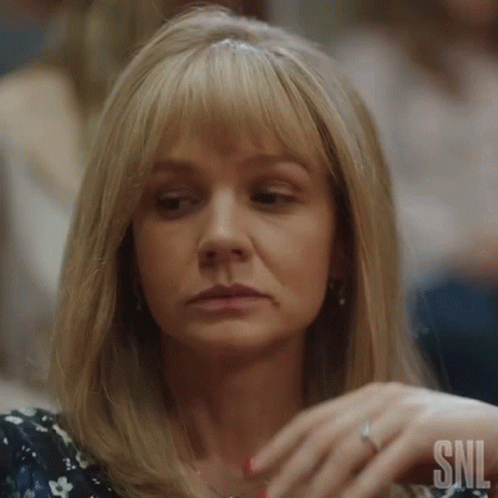 A Close Up Of A Woman 'S Face With The Snl Logo On The Bottom GIF