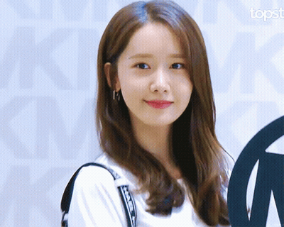 A Close Up Of A Woman 'S Face With The Topst Logo In The Corner GIF