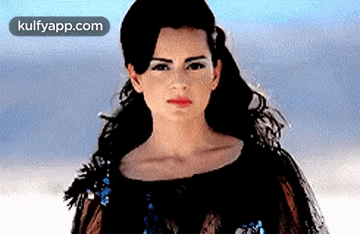 A Close Up Of A Woman 'S Face With The Website Kulfyapp.com In The Corner . GIF
