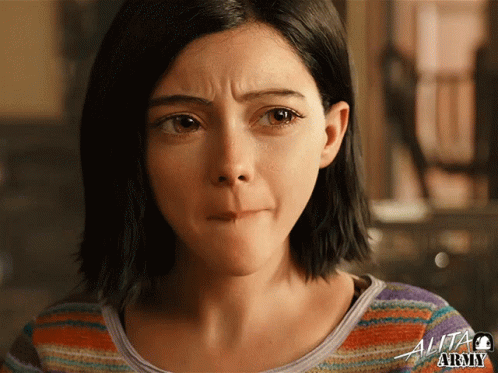 A Close Up Of A Woman 'S Face With The Word Alita Army On The Bottom Right GIF