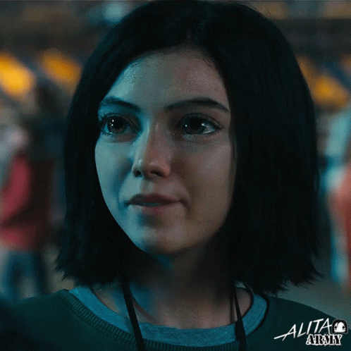 A Close Up Of A Woman 'S Face With The Word Alita Army On The Bottom Right GIF