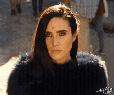 A Close Up Of A Woman 'S Face With The Word Alta On The Bottom Left GIF