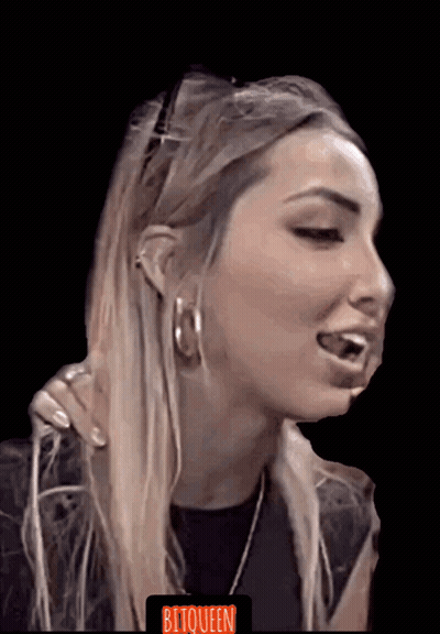 A Close Up Of A Woman 'S Face With The Word Bitqueen On The Bottom Left GIF