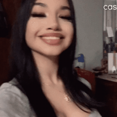 A Close Up Of A Woman 'S Face With The Word Cas On The Bottom Right GIF