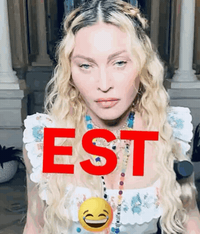 A Close Up Of A Woman 'S Face With The Word Est In Red GIF