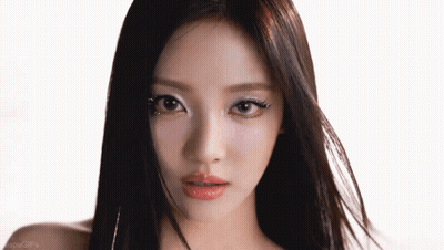 A Close Up Of A Woman 'S Face With The Word Gifs On The Bottom Left GIF