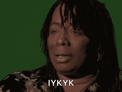 A Close Up Of A Woman 'S Face With The Word Iykyk Written On It GIF