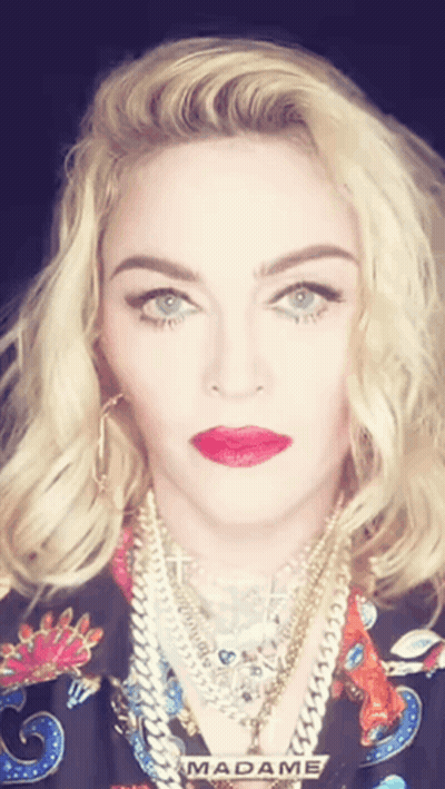 A Close Up Of A Woman 'S Face With The Word Madame Visible GIF