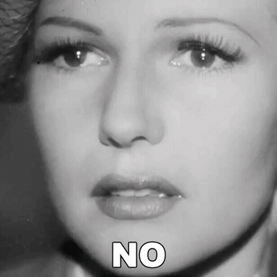 A Close Up Of A Woman 'S Face With The Word No Written Below Her GIF