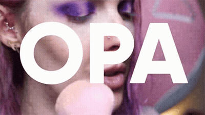 A Close Up Of A Woman 'S Face With The Word Opa In White GIF
